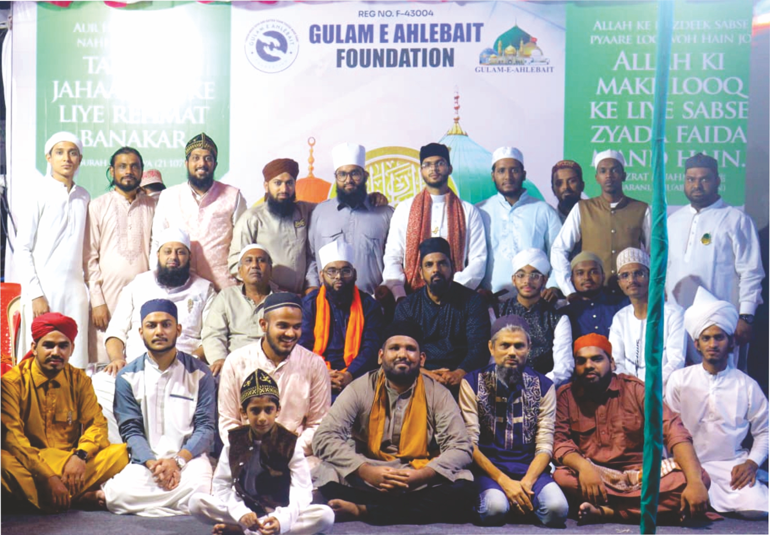 Foundation members gathered in front of the organisation's banner