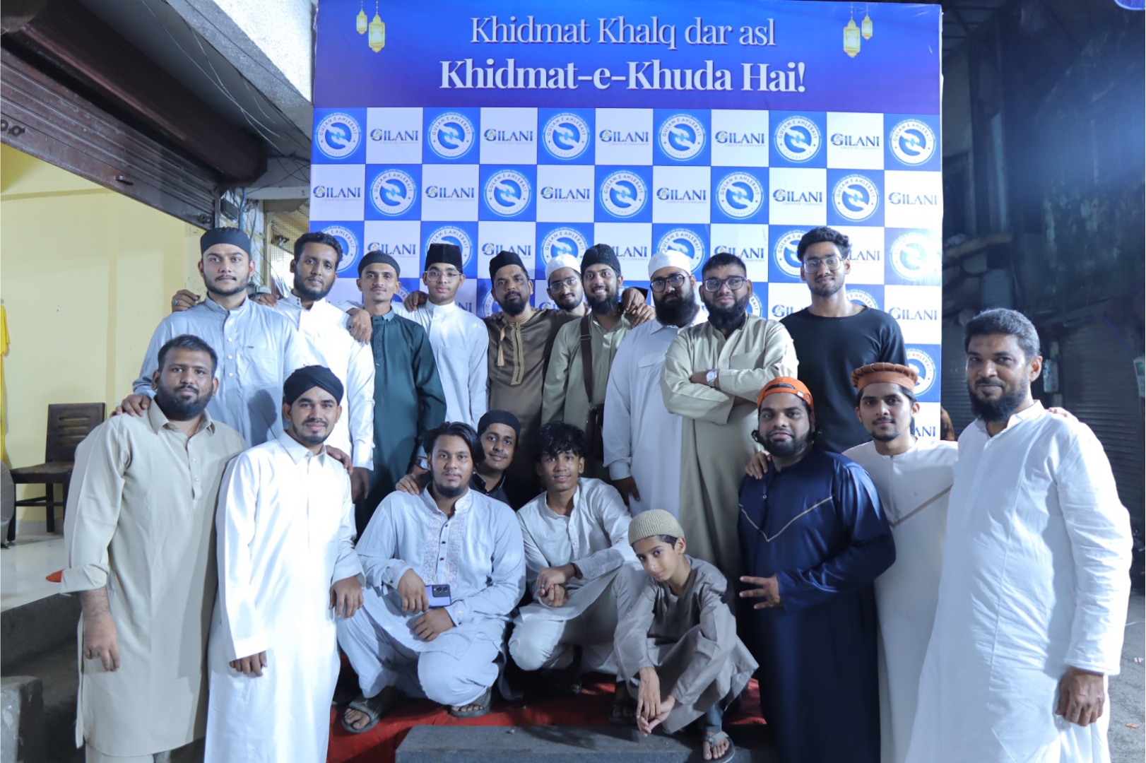 Foundation team gathered beneath the Khidmat-e-Khuda banner